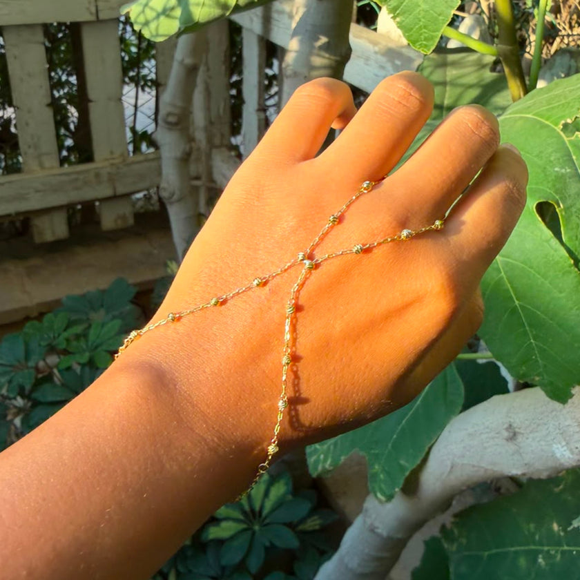 studed cross hand chain