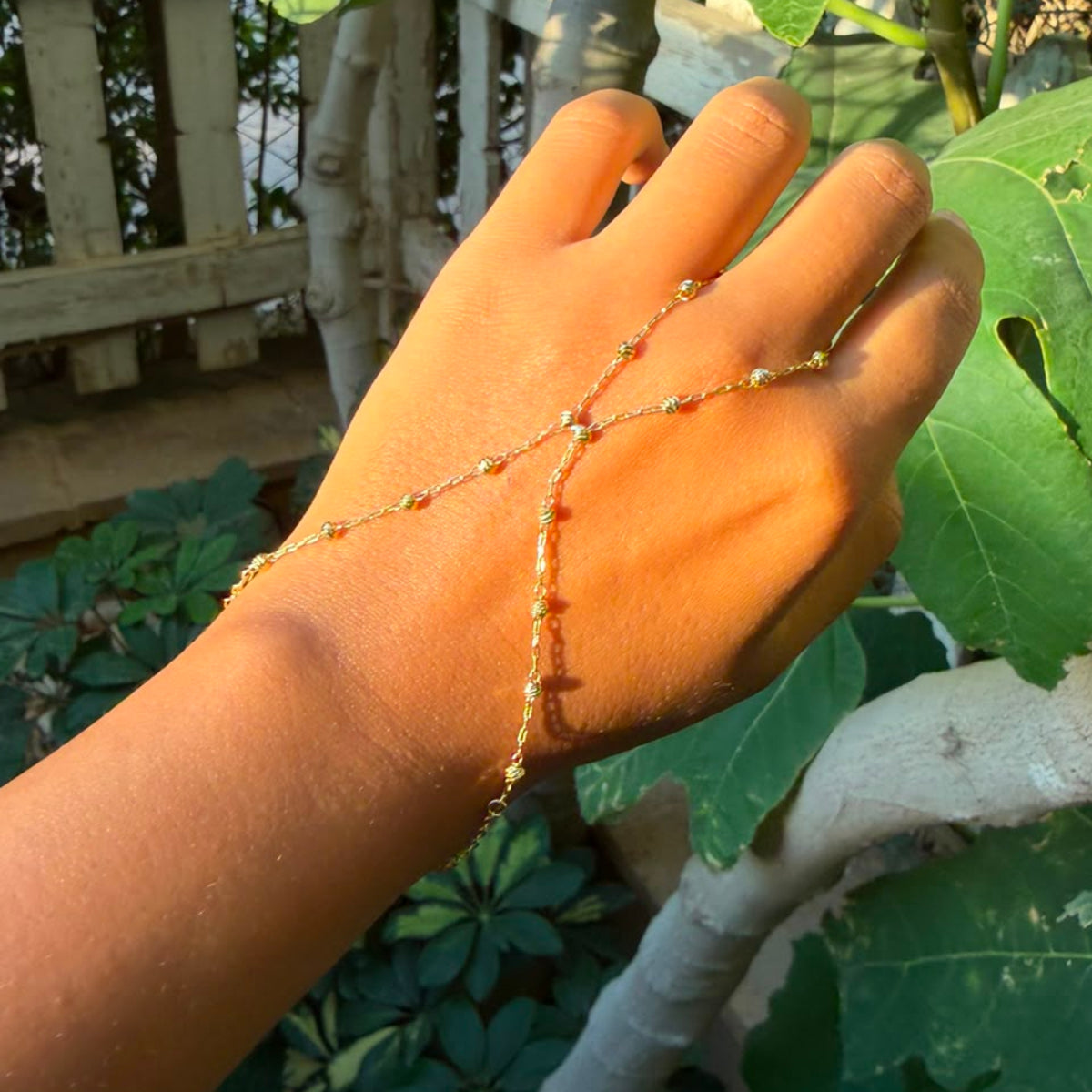 studed cross hand chain